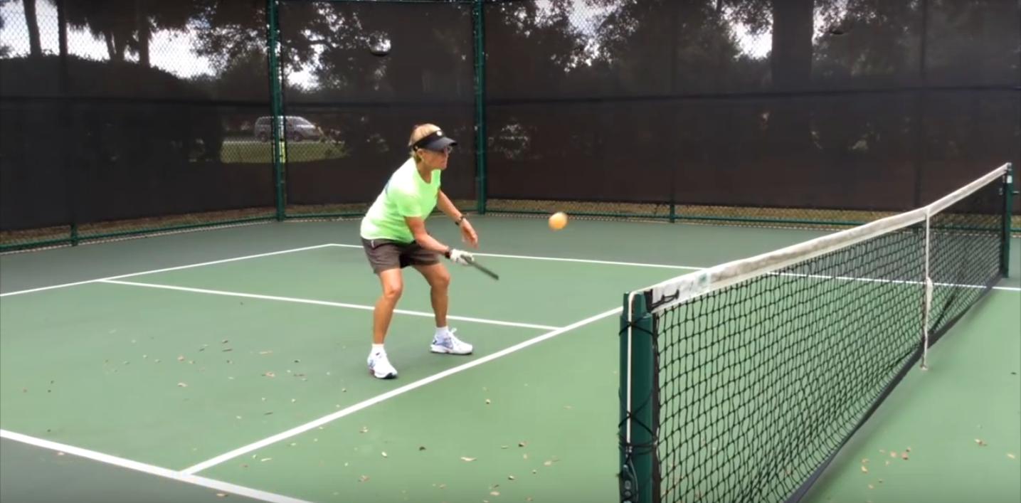 How do you watch an instructional video on pickleball?